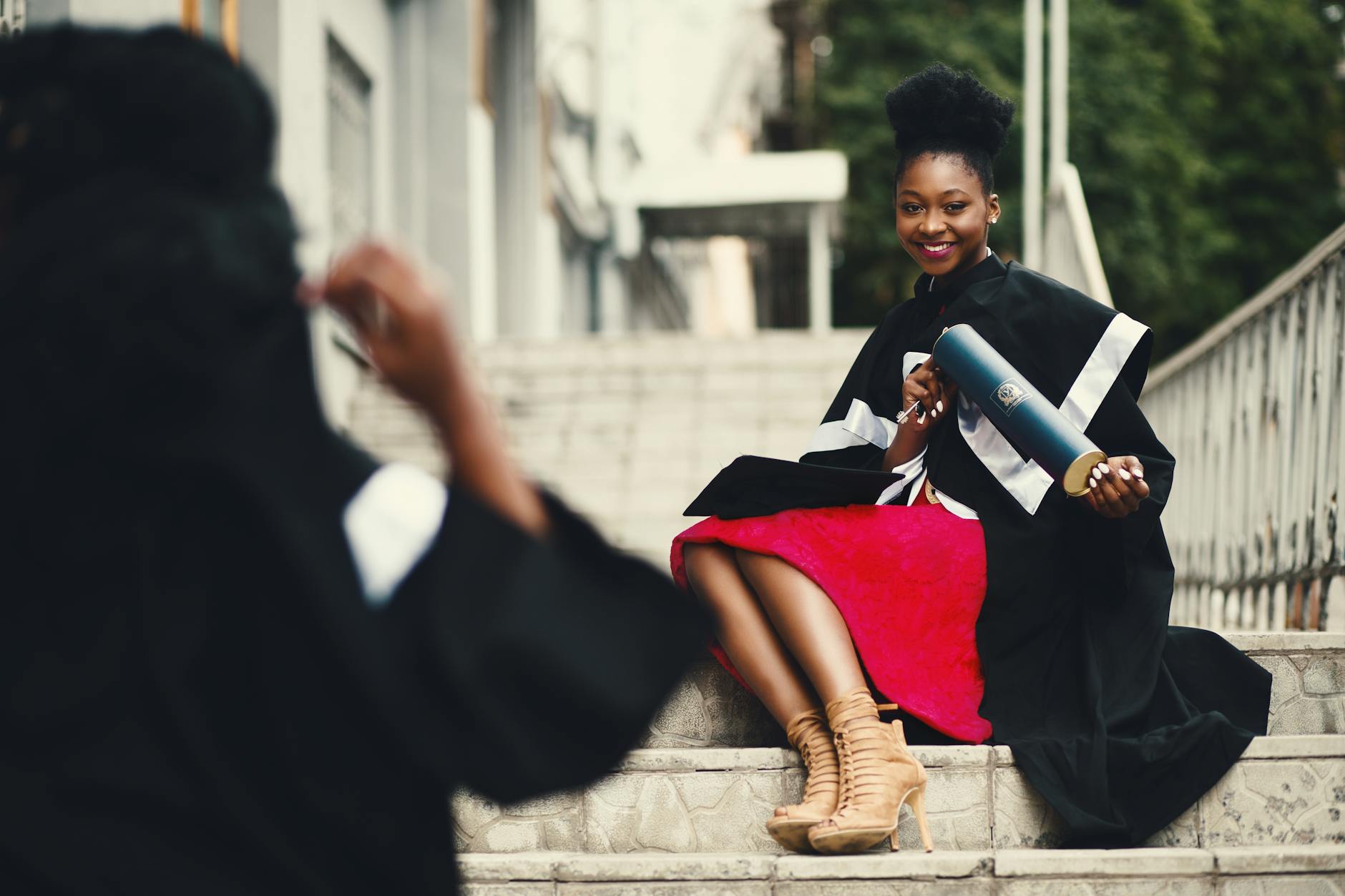 Photo by Godisable Jacob on <a href="https://www.pexels.com/photo/woman-wearing-black-graduation-coat-sits-on-stairs-901962/" rel="nofollow">Pexels.com</a>