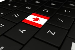 3D rendering close up of Canada flag button on laptop keyboard.