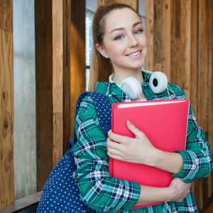 Photo by Anastasiya Gepp on <a href="https://www.pexels.com/photo/woman-standing-in-hallway-while-holding-book-1462630/" rel="nofollow">Pexels.com</a>