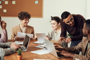 Photo by fauxels on <a href="https://www.pexels.com/photo/group-of-people-gathered-around-wooden-table-3184360/" rel="nofollow">Pexels.com</a>