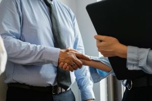 Photo by Sora Shimazaki on <a href="https://www.pexels.com/photo/man-and-woman-shaking-hands-in-office-5668842/" rel="nofollow">Pexels.com</a>
