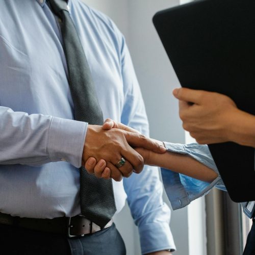 Photo by Sora Shimazaki on <a href="https://www.pexels.com/photo/man-and-woman-shaking-hands-in-office-5668842/" rel="nofollow">Pexels.com</a>
