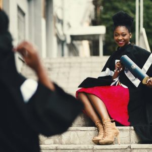 Photo by Godisable Jacob on <a href="https://www.pexels.com/photo/woman-wearing-black-graduation-coat-sits-on-stairs-901962/" rel="nofollow">Pexels.com</a>